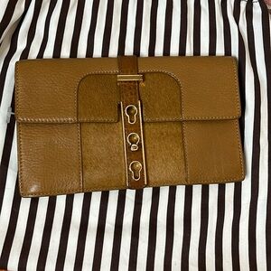 AUTHENTIC Henri Bendel leather clutch